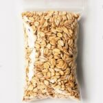 stock-photo-plastic-transparent-zipper-bag-with-full-oatmeal-raw-flakes-isolated-on-white-vacuum-package-570879094-transformed